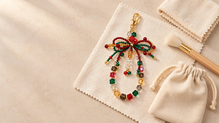 Beaded car charm with a soft brush, microfiber cloth, and storage pouch for gentle care